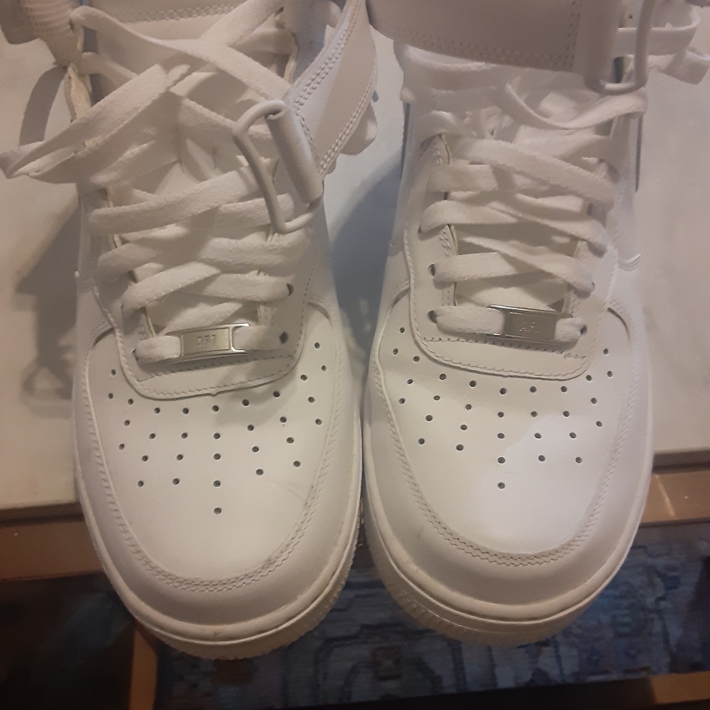A white pair of Nike Air Force Ones